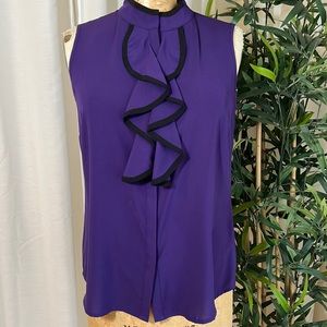 Sleeveless, high collar blouse with ruffle detail